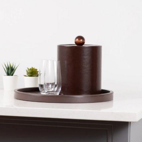 Decorative brown vase on a white surface with a white background