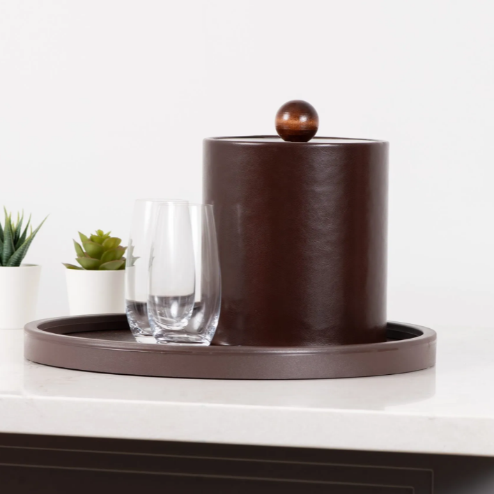 Brown ceramic ice bucket with a lid on a white surface with a white background