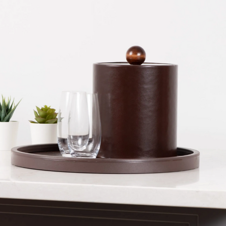 Brown ceramic ice bucket with a lid on a white surface with a white background