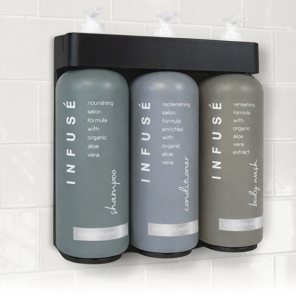 Three gray bottles labeled 'Infuse' on a white tiled wall.
