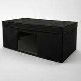 Black storage ottoman on a white background