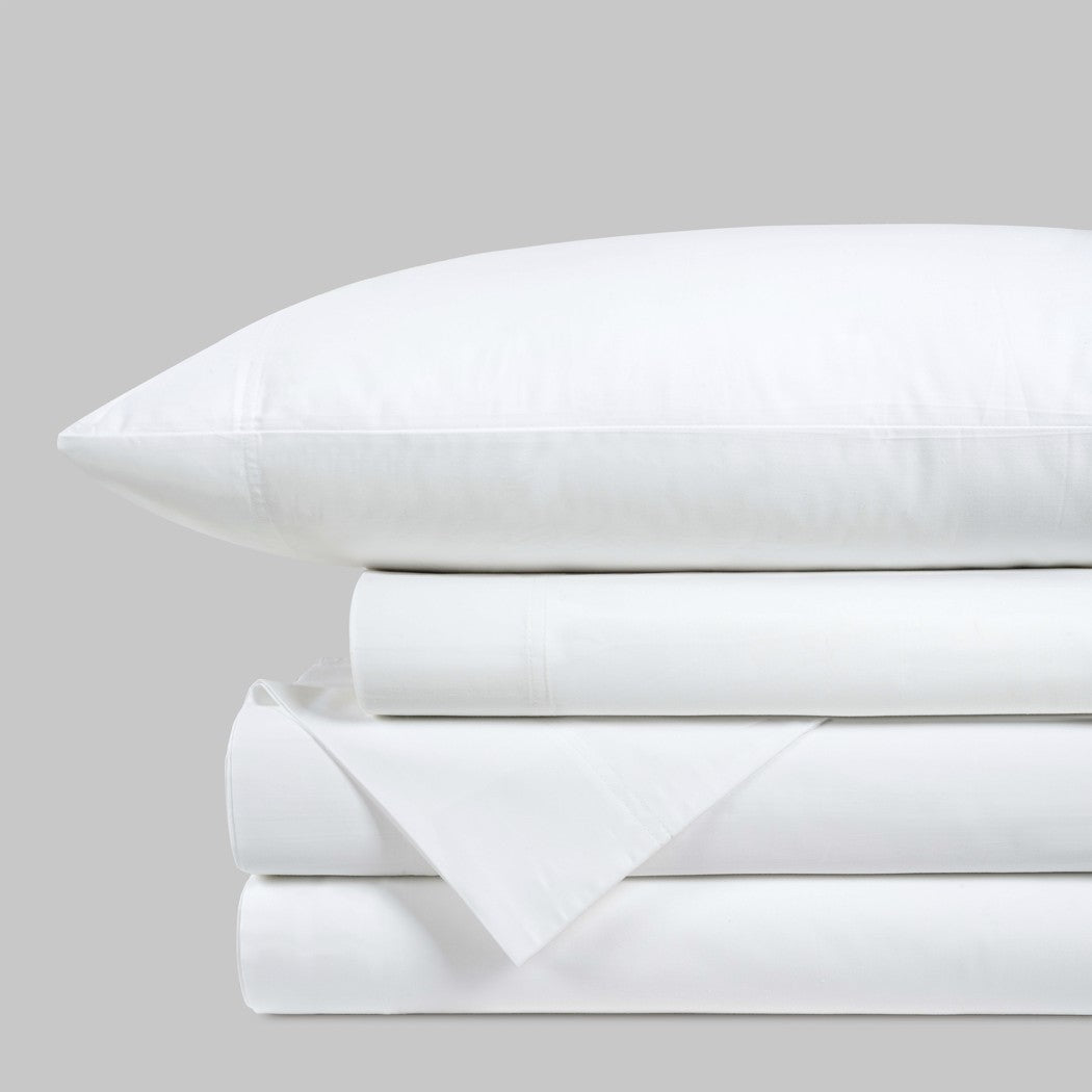 Blackfin by Boston Textile White bed sheets and pillowcase set on a light gray background