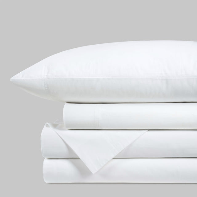 Blackfin by Boston Textile White bed sheets and pillowcase set on a light gray background