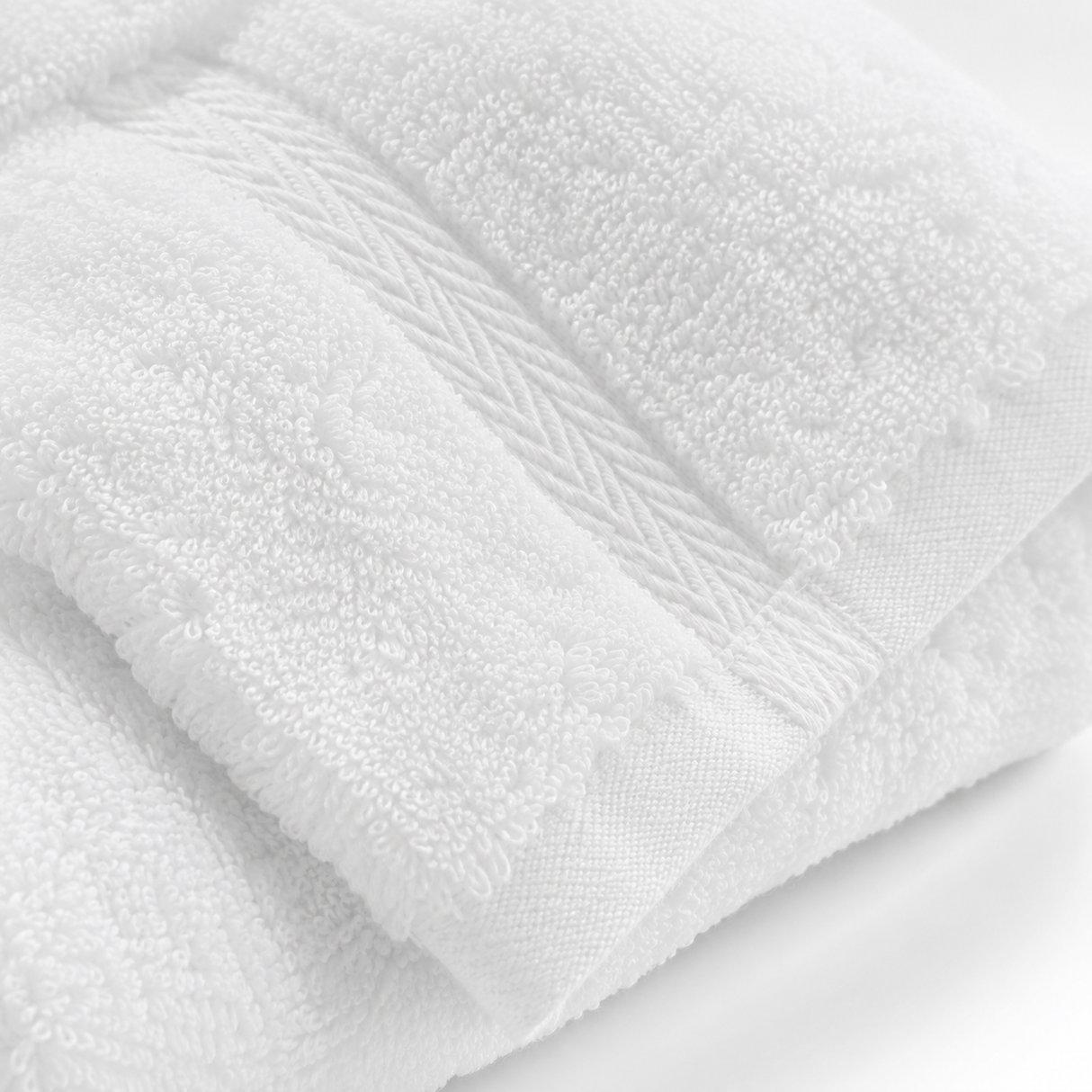 Close-up of a white towel with visible texture