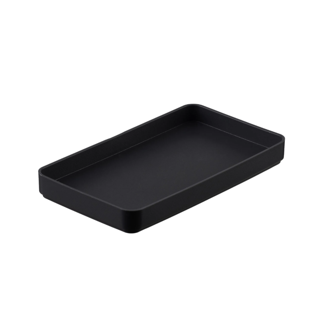 Black amenity tray on white background.