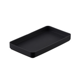 Black amenity tray on white background.