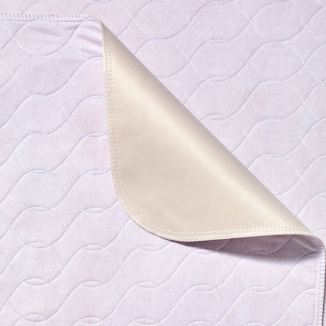 White quilted fabric with a folded corner on a matching background