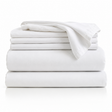 Folded stack of white bed sheets