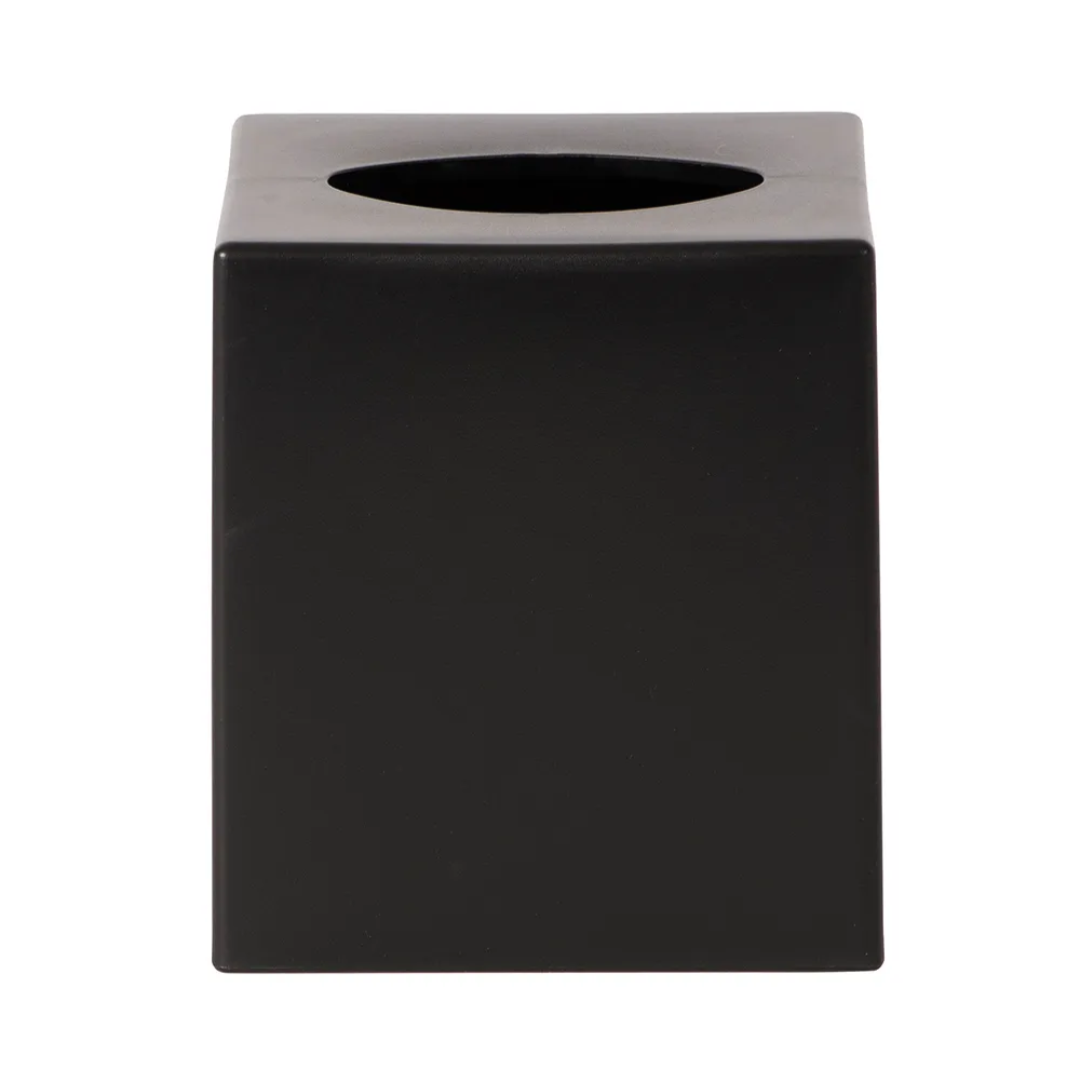 Black cube-shaped object with a metallic top on a white background