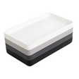 Three-layered tray with white, gray, and black sections on a white background