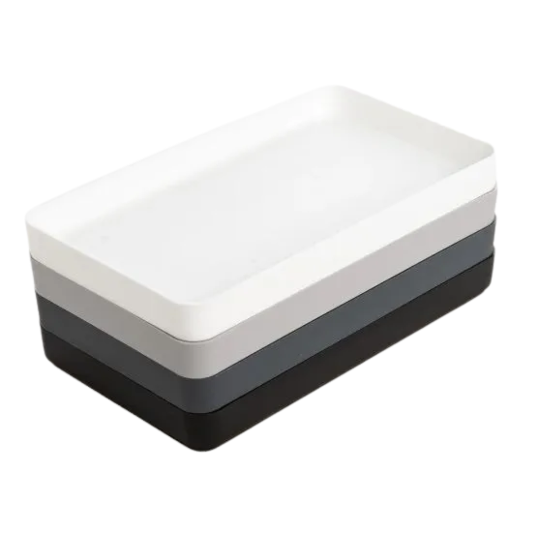 Three-layered tray with white, gray, and black sections on a white background