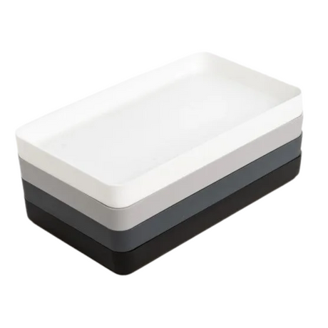 Three-layered tray with white, gray, and black sections on a white background