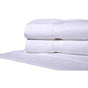 Pictured: Half shot of two white towels neatly folded and stacked on top of a white bath mat against a white background
