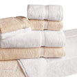 Pictured: White and beige towels neatly folded and stacked on top of one white and one beige bath mat against a white background.
