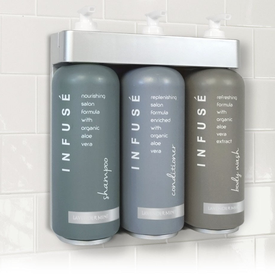 Three gray bottles labeled 'Infuse' on a white tiled wall.
