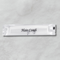 White comb packet labeled 'Hair Comb' on a gray background