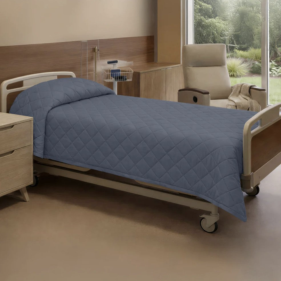 Hospital room with a bed, chair, and window view