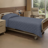 Hospital room with a bed, chair, and window view