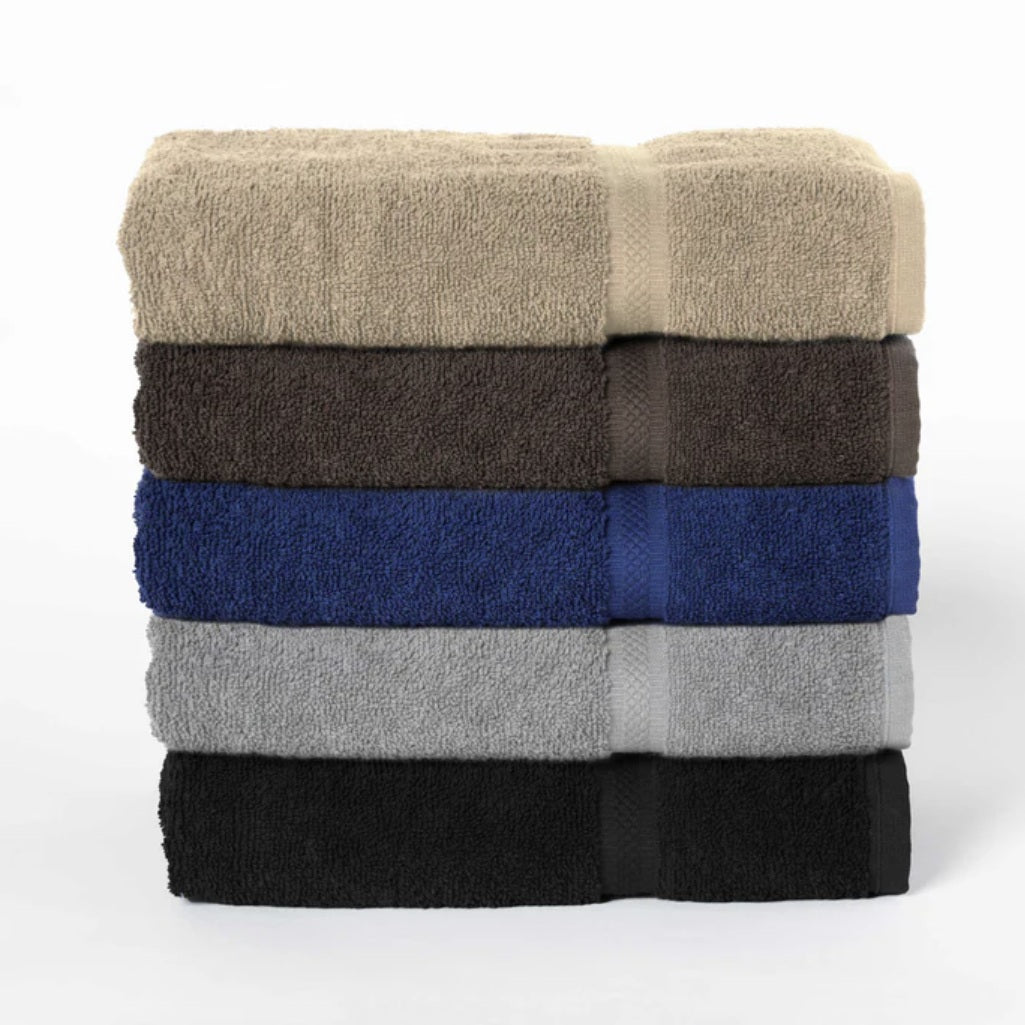 Stack of folded towels in beige, brown, blue, gray, and black on a white background