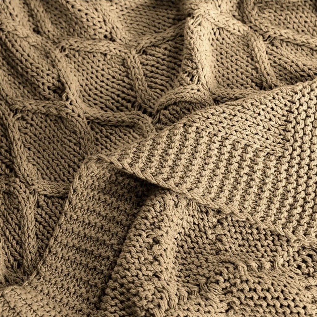 Close-up of a textured beige knitted fabric