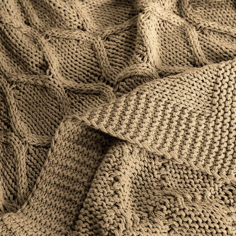 Pictured: Close up of the threading and texture of the Martex Atelier Bella Throw in the shade Latte.