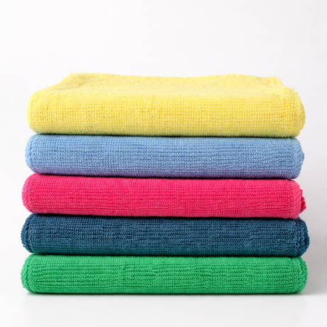 Stack of colorful microfiber cloths on a white background