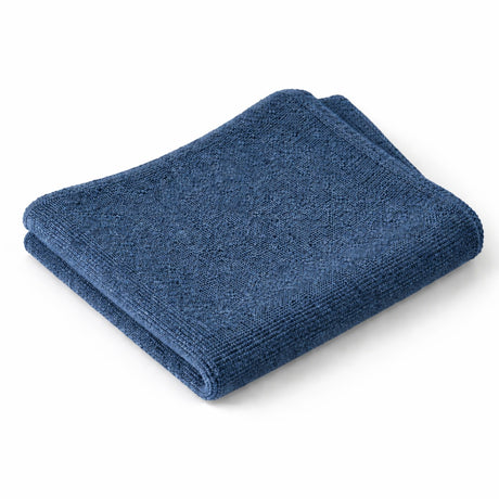 Folded blue towel on a white background