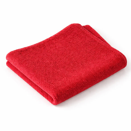 Folded red towel on a white background