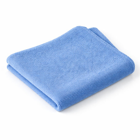 Folded blue towel on a white background