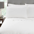 Pictured: Nicely made white bed on a grey fabric bedframe. The bedding features the Millennium T-250 Sheets.
