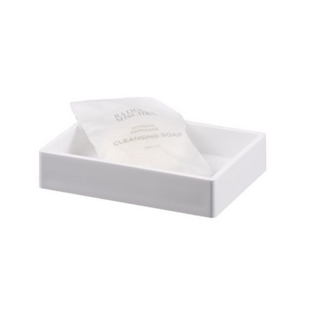 White soap dish with a bar of soap inside on a white background