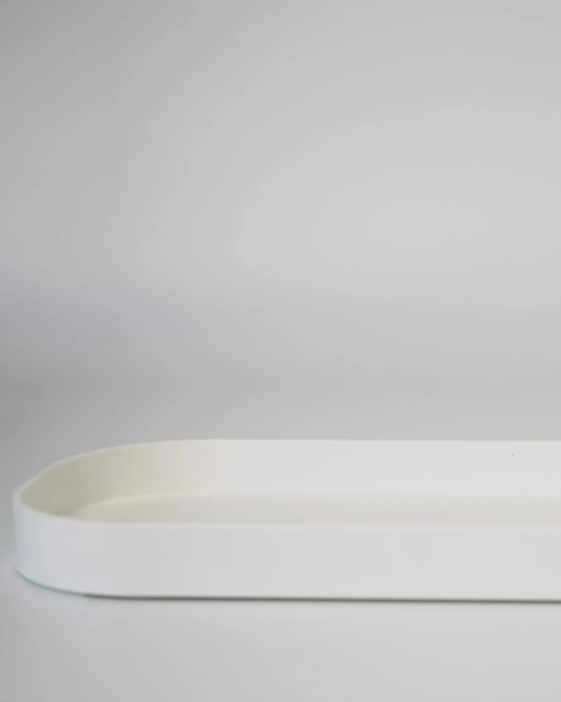 White ceramic tray on a gray background