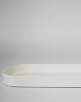 White ceramic tray on a gray background