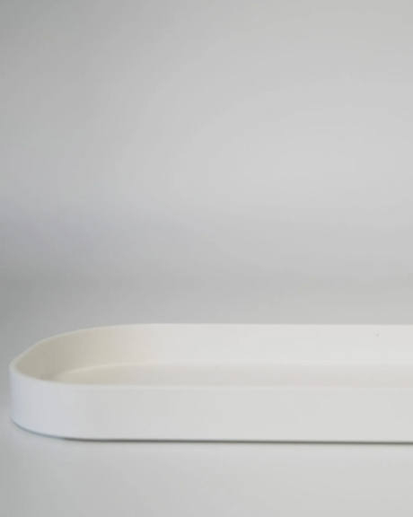 White ceramic tray on a gray background