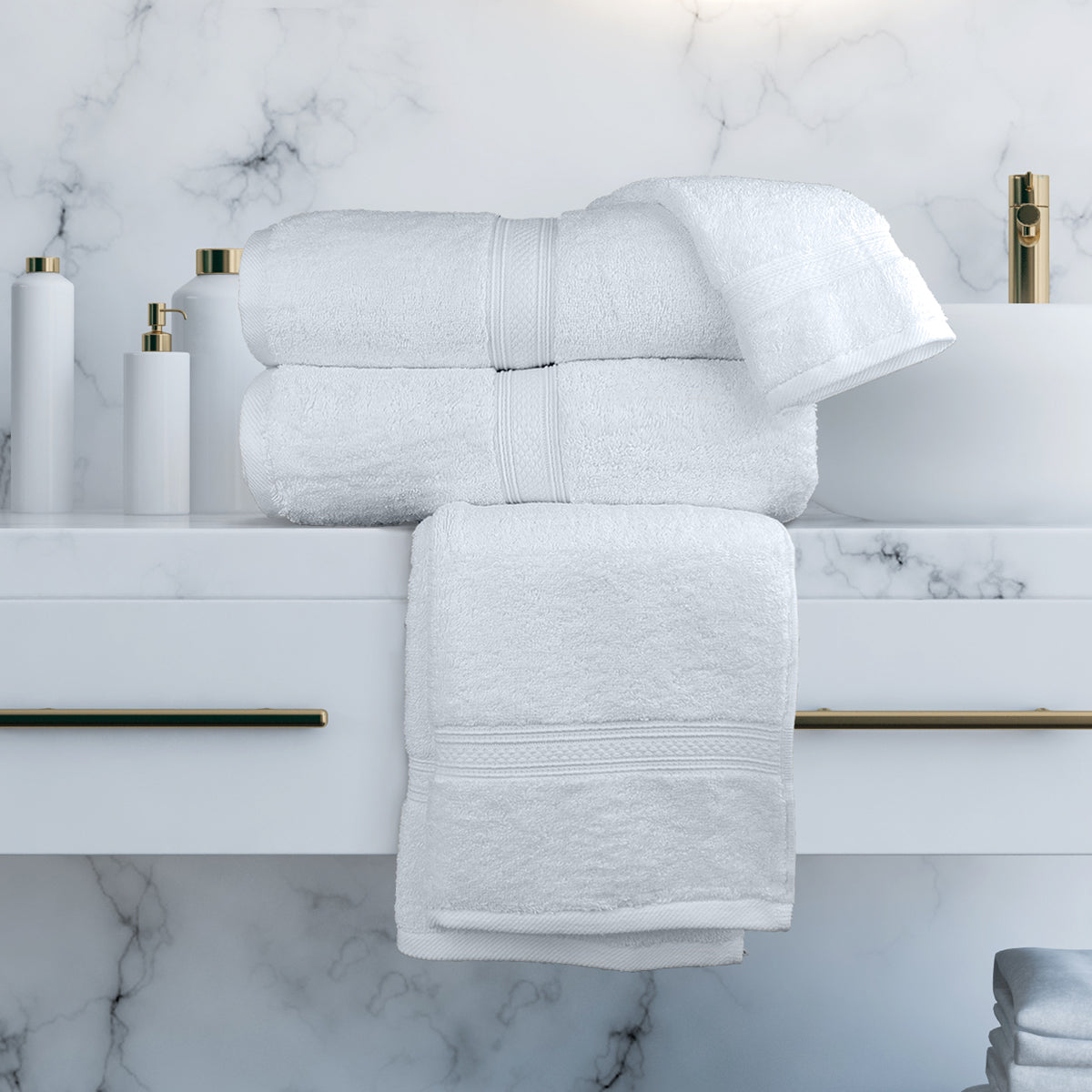 White towels on a marble bathroom counter