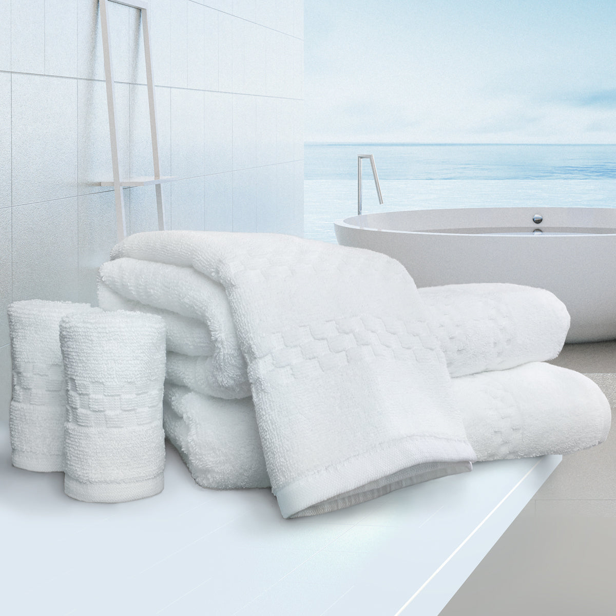 Stack of white towels on a bathroom counter with a bathtub in the background