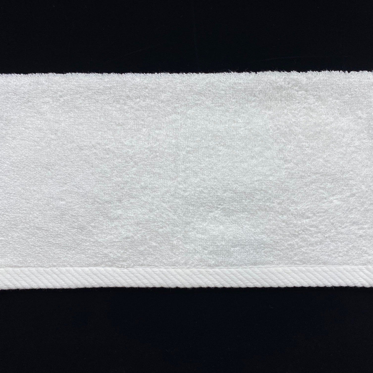 Close-up of a white textured band on a black background