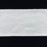 Close-up of a white textured band on a black background