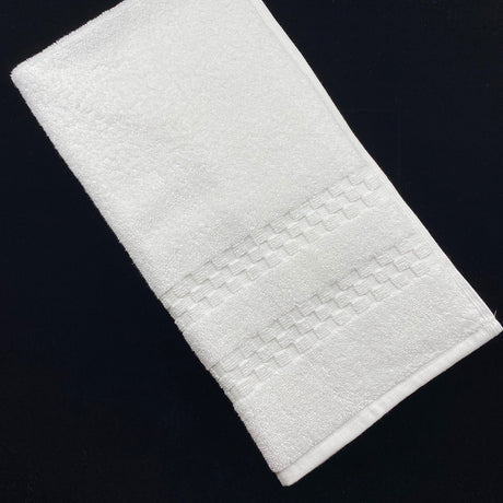 White textured bath mat on a black background