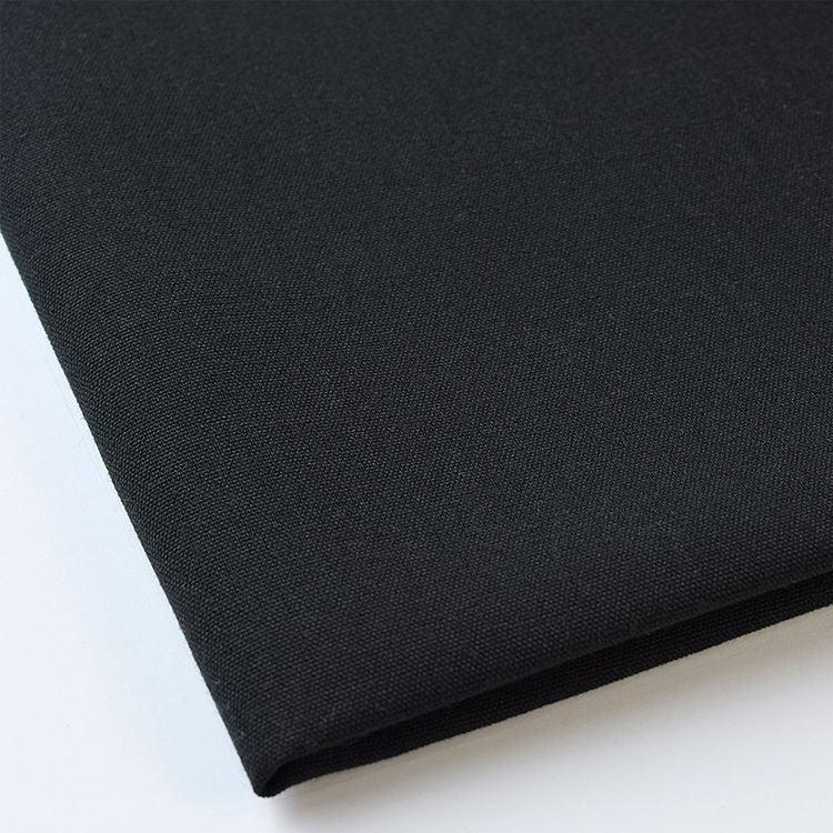 Pictured: Close up of the Premier Napkin neatly folded in the shade Black against a white background.