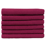 Pictured: Neatly folded stack of 6 magenta towels against a white background. These towels are in the shade Burgundy.
