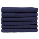 Pictured: Neatly folded stack of 6 deep blue towels against a white background. These towels are in the shade Navy.