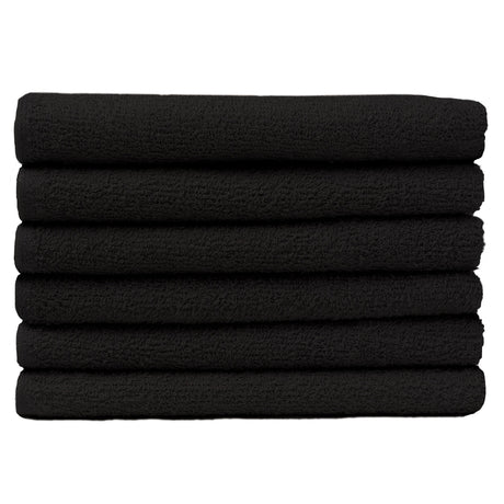 Pictured: Neatly folded stack of 6 dark towels against a white background. These towels are in the shade Black.