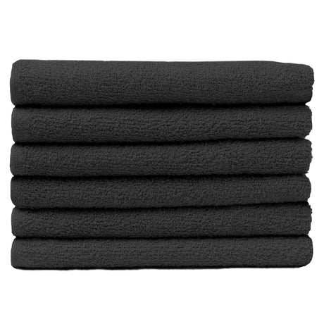 Pictured: Neatly folded stack of 6 deep grey towels against a white background. These towels are in the shade Charcoal.