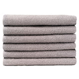 Pictured: Neatly folded stack of 6 light grey towels against a white background. These towels are in the shade Silver Grey.