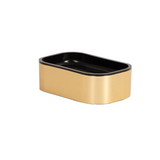 Rectangular container with black lid and gold base on a white background