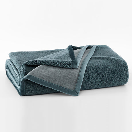 Folded blue towel on a white background