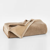 Beige fleece blanket on a white background