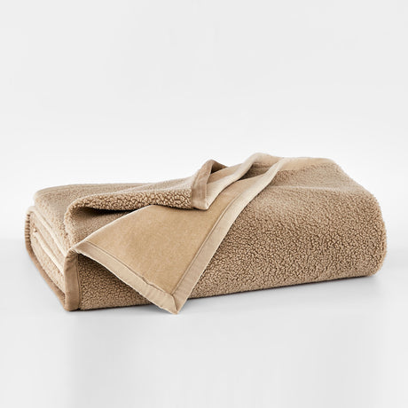 Beige fleece blanket on a white background