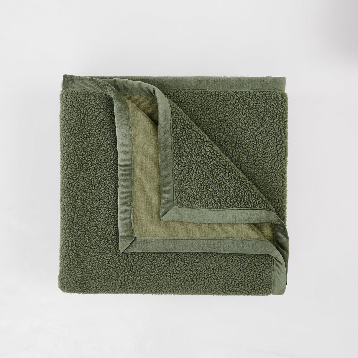 Green textured blanket on a white background